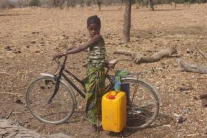 A girl with a jerrycan in Burkina Faso