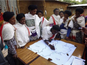 Locals drawing a map as part of groundwater monitoring initiatives in Ethiopia (credit: David Walker)