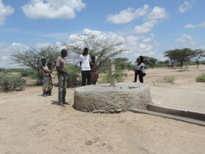 Florence at Kakemera Community handpump (May 2018) | Documentation of groundwater sources and their hydrogeological setting in the Lodwar area allows for a detailed understanding of their operational, water quality and pollution status, and the potential for resource development