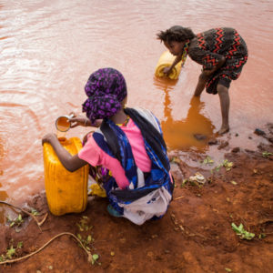 A mother and daughter collected water from a river in Ethiopia; Credit: Martchan