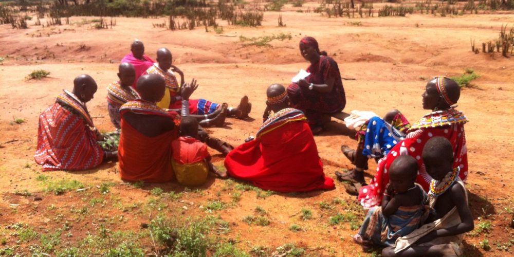 Research assistant, Jaqueline Nalenoi, discussing water security with a group of women in Sessia location, Samburu