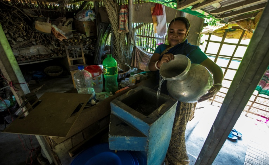 Woman storing water in Satkhira; photo credit: COAST