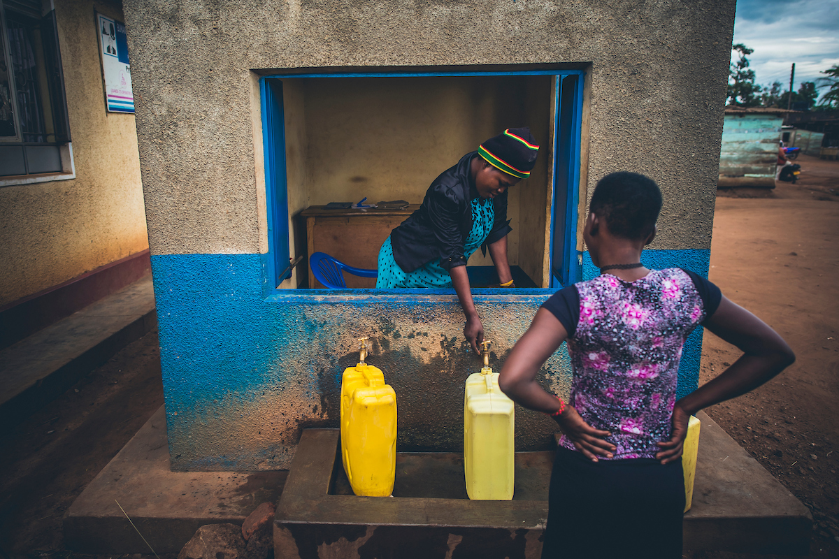 A girl collects water from a kiosk in Uganda prior to the COVID-19 pandemic (Photo courtesy of Water Mission)